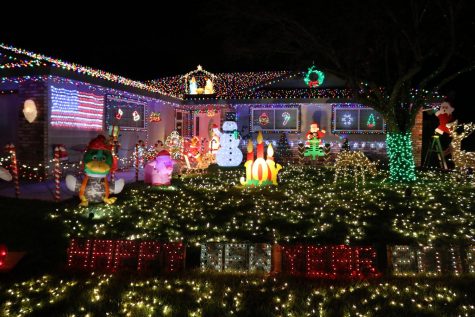 Maintenance worker decks the halls off campus