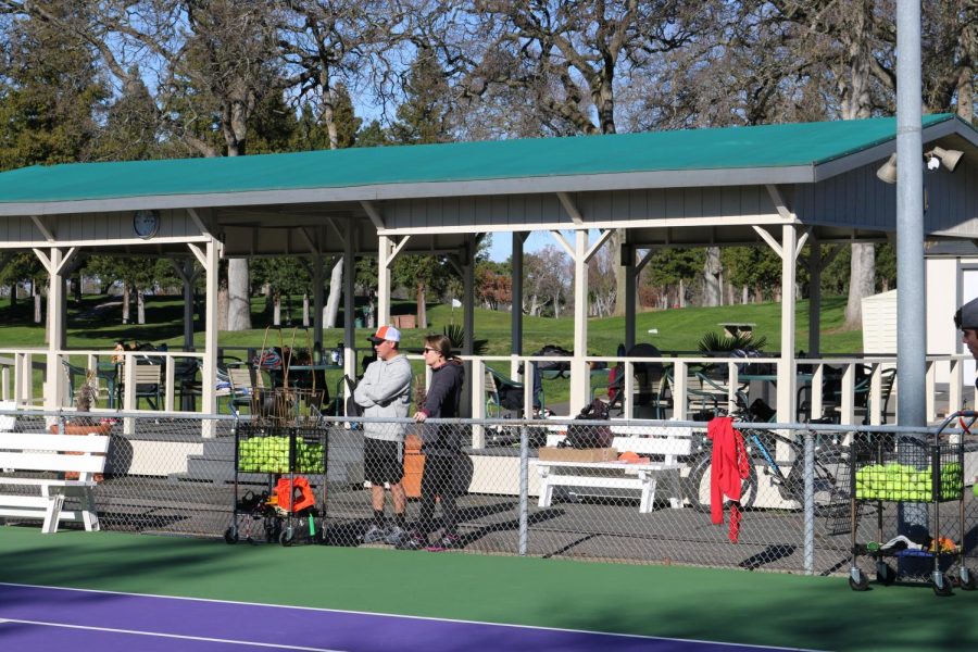 New+tennis+coaches+Michael+Cerecedes+and+Teri+Lacey+recently+took+over+RHS%E2%80%99s+varsity+tennis+team%2C+both+now+coaching+their+sons+on+the+team.