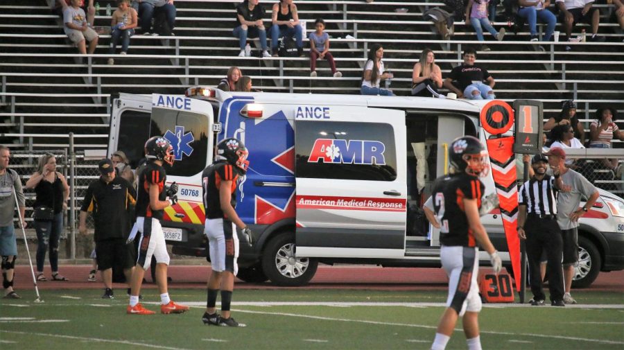 %2324+Tyler+Rhower+is+led+away+by+EMTs+after+an+apparent+knee+injury.+He+suffered+a+torn+ligament+in+his+ankle.